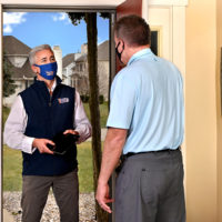 THE PATCH BOYS drywall hole repair franchise franchisee greets homeowner at the door